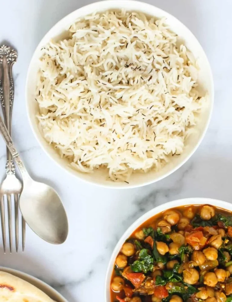 A delicious bowl of jeera rice made in an Instant Pot, garnished with coriander.