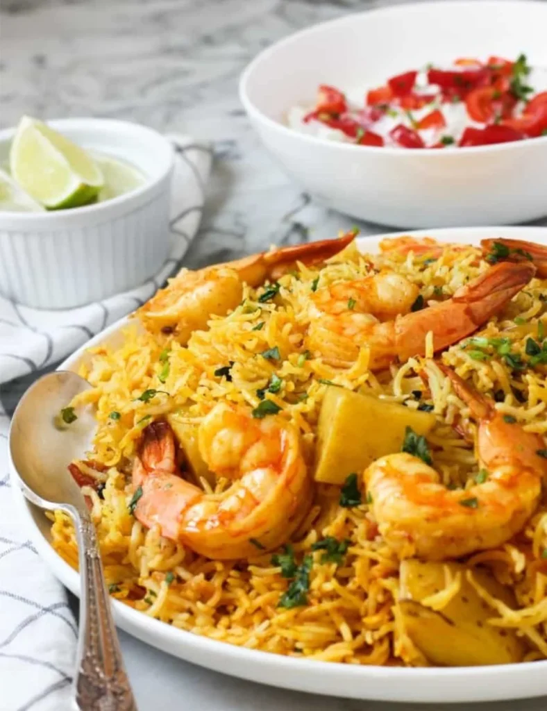 Delicious Instant Pot Shrimp Biryani served in a bowl, garnished with herbs.