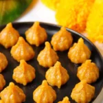Delicious Mawa Modak sweets served on a traditional platter.