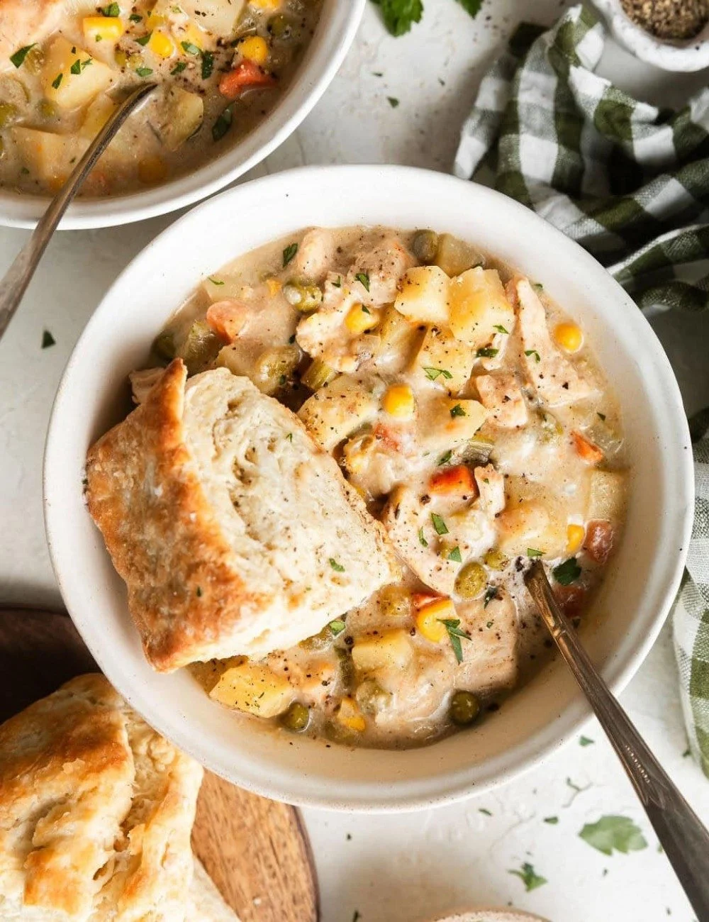 Bowl of slow cooker chicken pot pie soup with vegetables and chicken