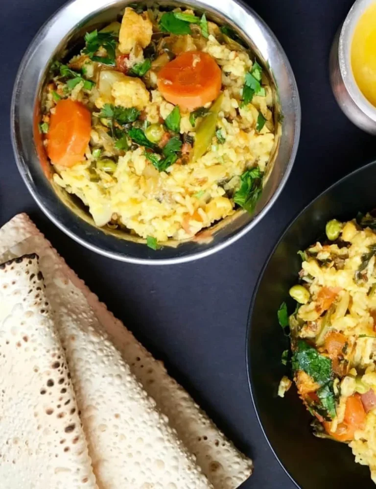 A bowl of colorful Vegetables Khichdi garnished with fresh herbs.
