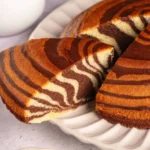 Deliciously layered Zebra Cake with chocolate and vanilla swirls