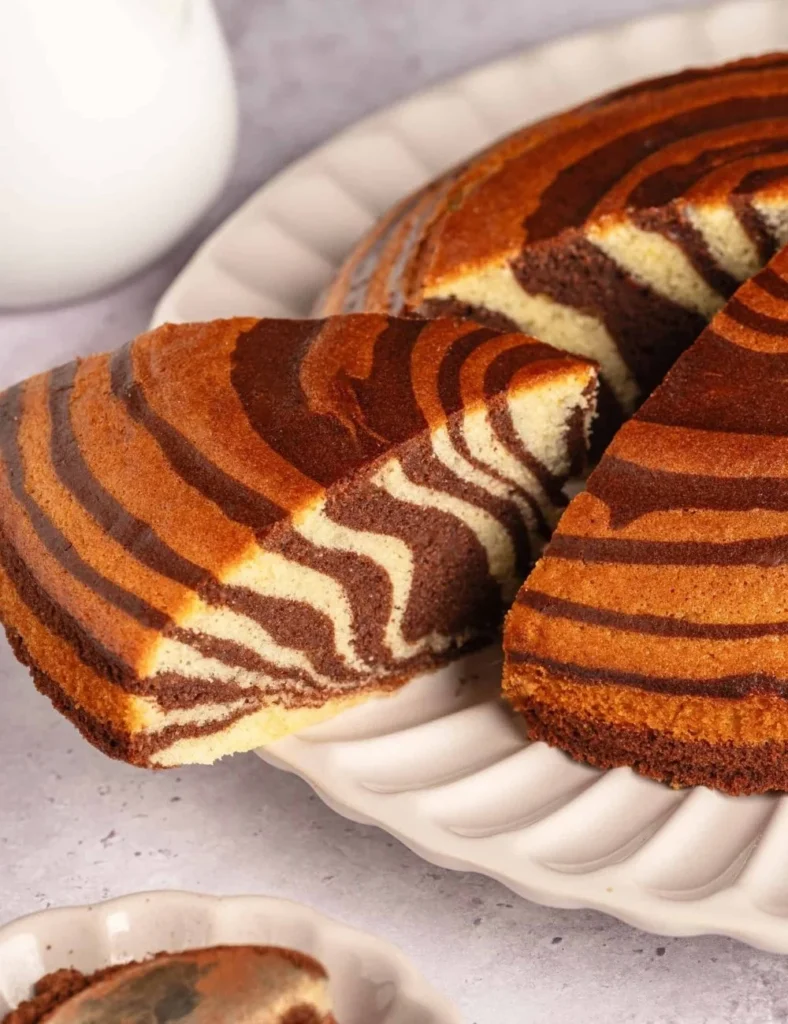 Deliciously layered Zebra Cake with chocolate and vanilla swirls