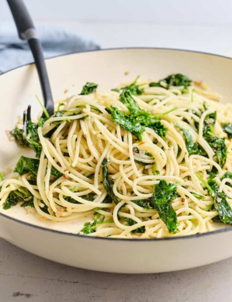 Delicious plate of kale pasta tossed with fresh ingredients
