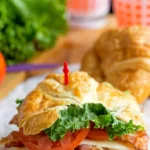 California Club Croissant Sandwich with fresh ingredients