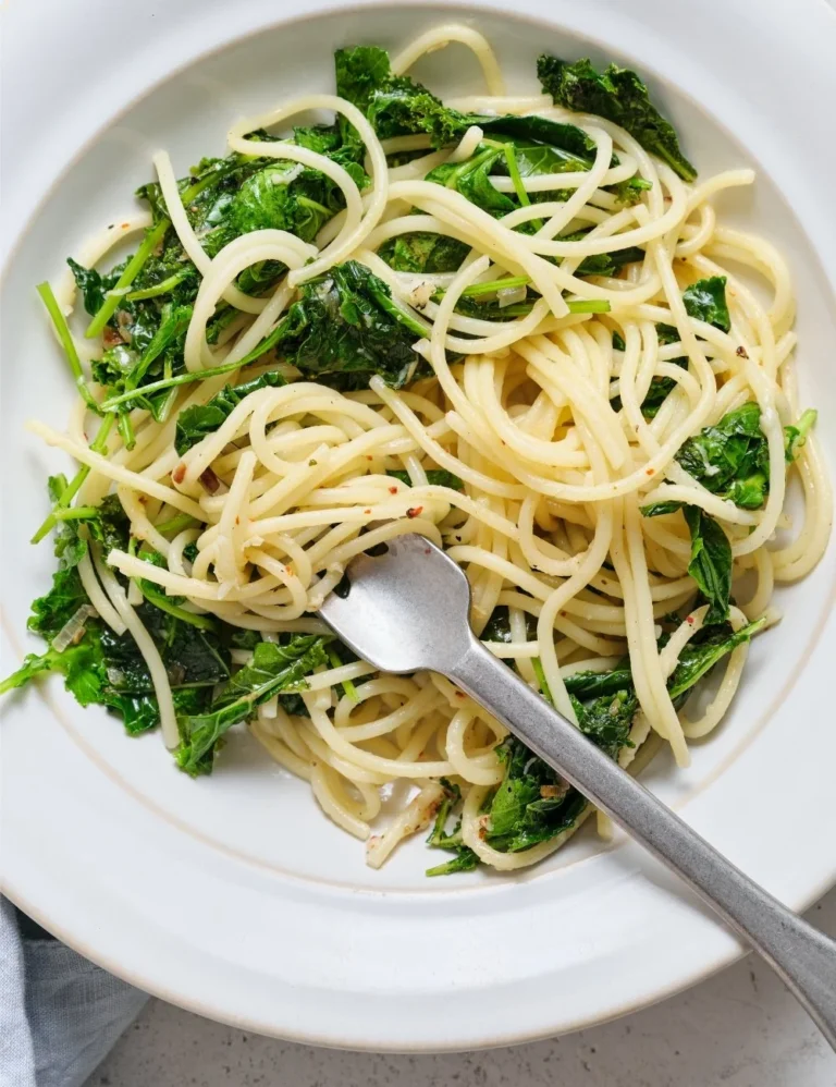 Delicious plate of kale pasta tossed with fresh ingredients